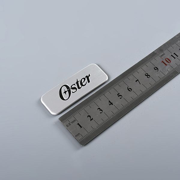Graverad logotyp metall Taggar