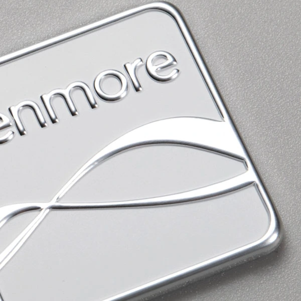 Logotyptagg i aluminium